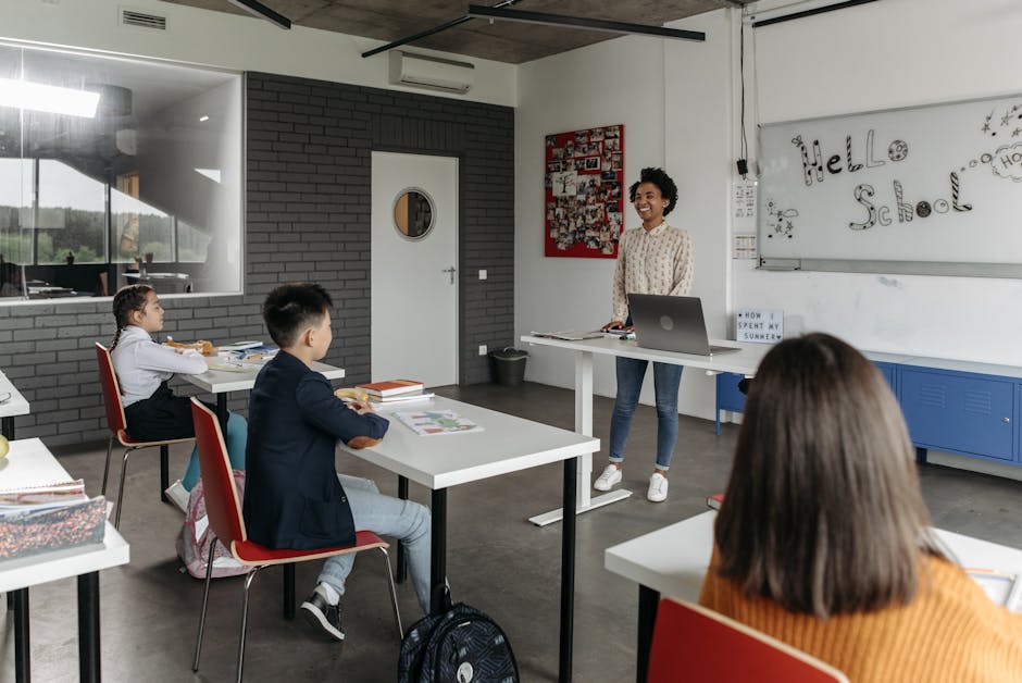 A modern classroom with a teacher and attentive students engaged in a lesson